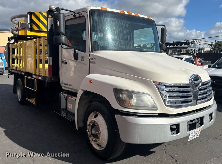 image for item EN6001 2010 Hino 268 flatbed truck with crash attenuator