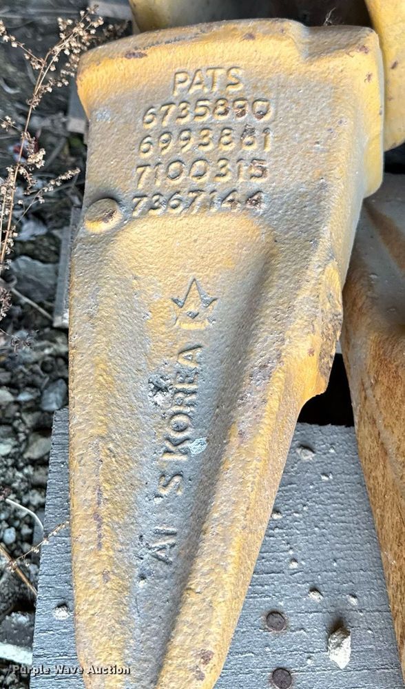 image for item EC4090 (2) pallets of Caterpillar bucket teeth