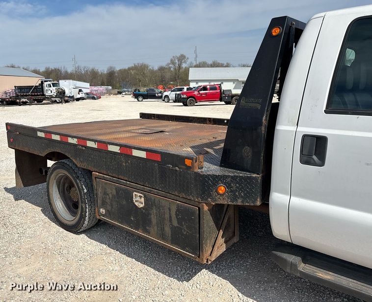 image for item EM0033 2013 Ford F550 Super Duty Crew Cab flatbed truck
