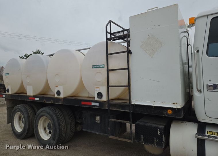 image for item EN8873 1994 White GMC WB water truck