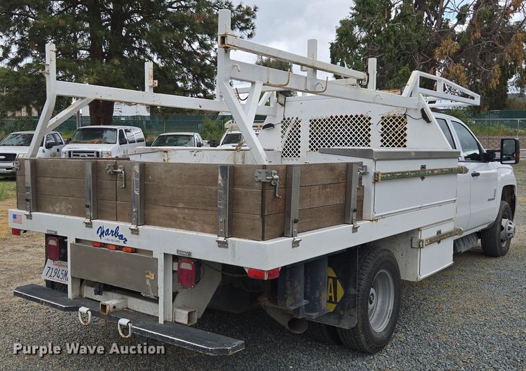 image for item EC0911 2018 Chevrolet Silverado 3500HD Crew Cab flatbed pickup truck