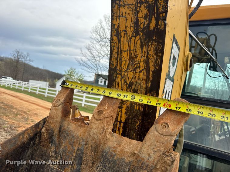 image for item DV1899 1997 John Deere 310E backhoe