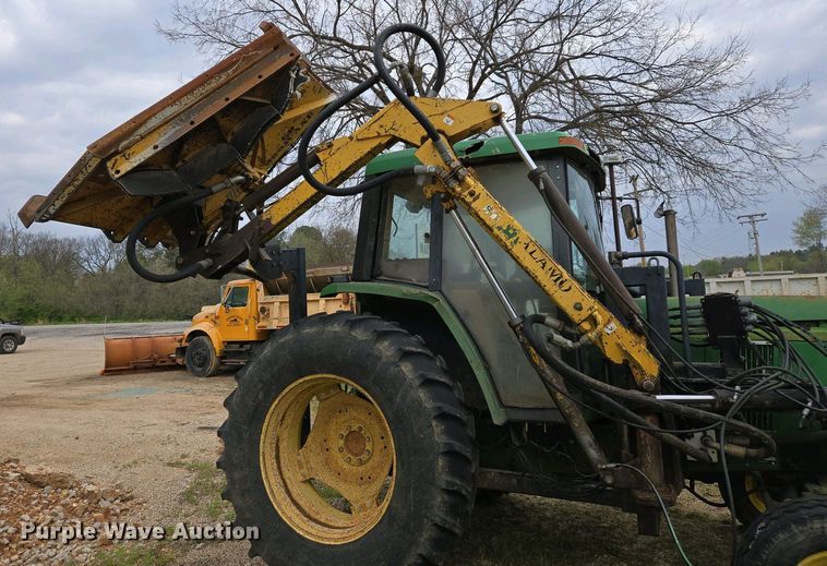 image for item EJ7441 2001 John Deere 6310 tractor