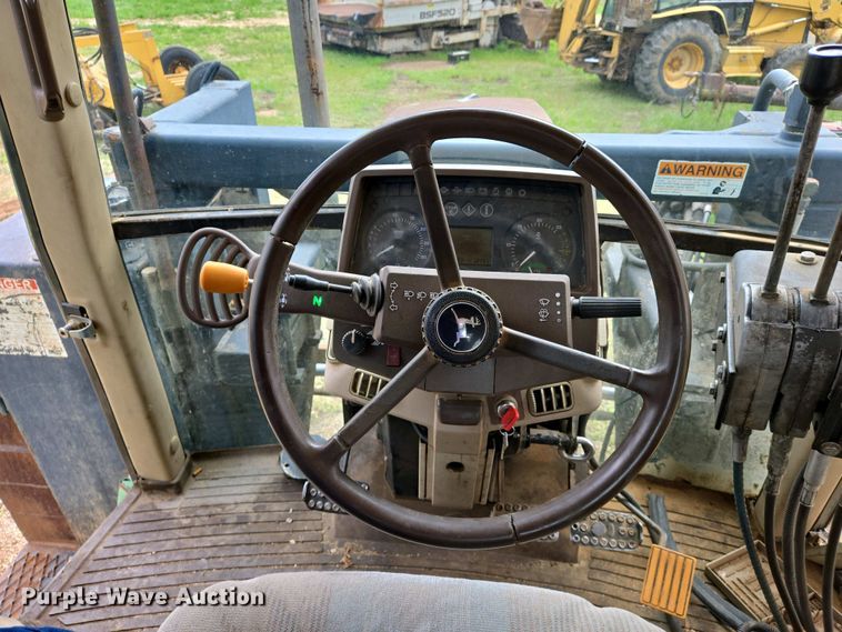 image for item EJ7441 2001 John Deere 6310 tractor