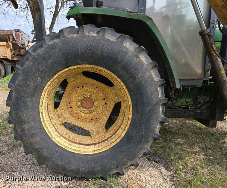 image for item EJ7441 2001 John Deere 6310 tractor
