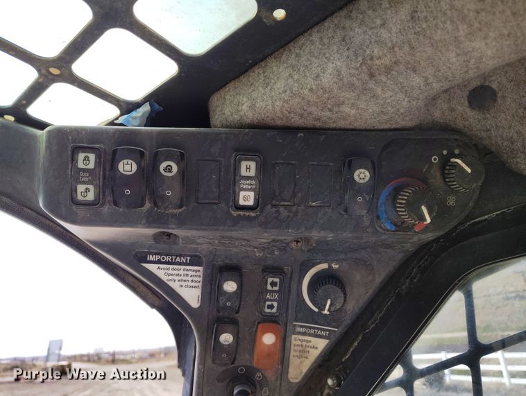 image for item EH0235 2012 John Deere 323D tracked skid steer loader