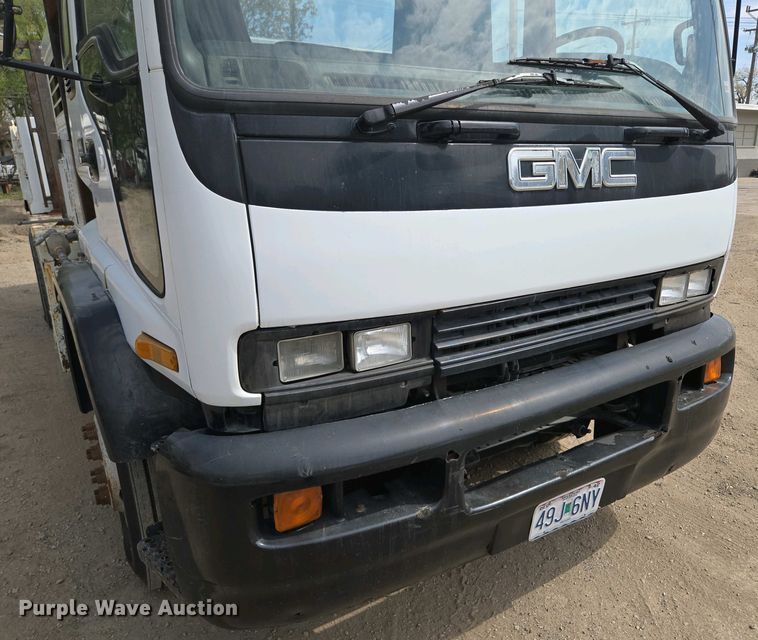 image for item EM7055 1999 GMC T7500 utility / service truck