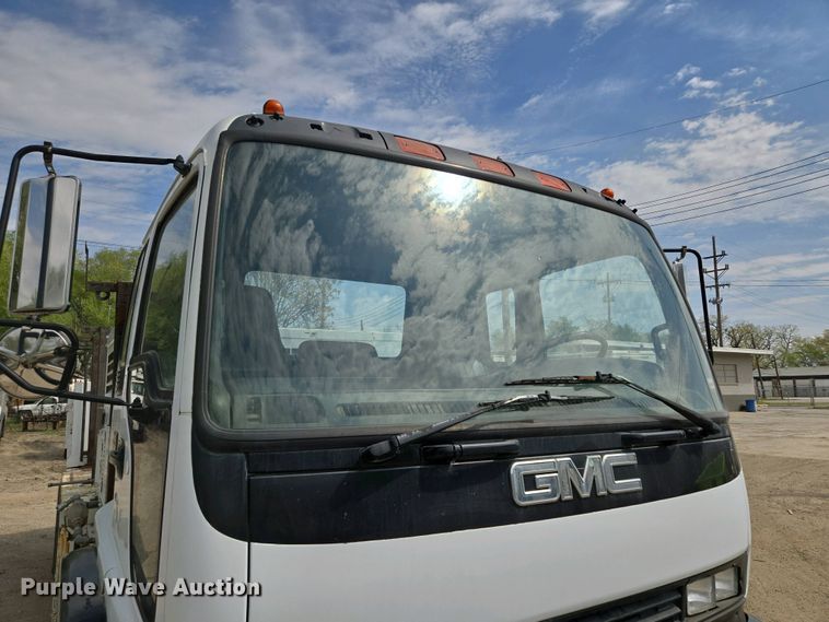 image for item EM7055 1999 GMC T7500 utility / service truck