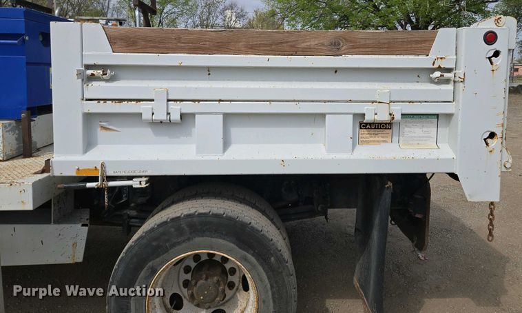 image for item EM7055 1999 GMC T7500 utility / service truck