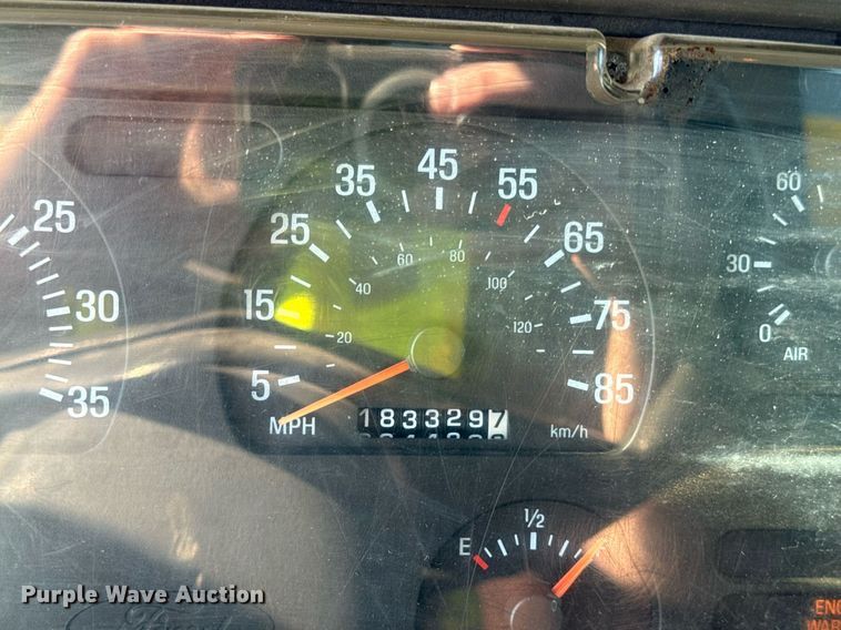 image for item EF1987 1998 Ford L8501 flatbed truck