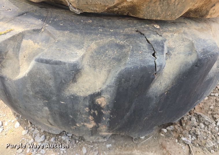 image for item EK5222 (4) Firestone 15.5-25 foam filled tires and wheels