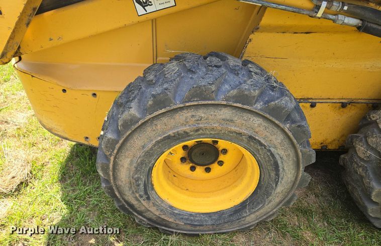 image for item EM7330 2003 John Deere 270 Series II skid steer loader