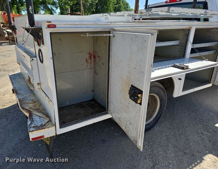 image for item ED2003 2009 GMC Sierra 3500HD Ext. Cab utility bed pickup truck