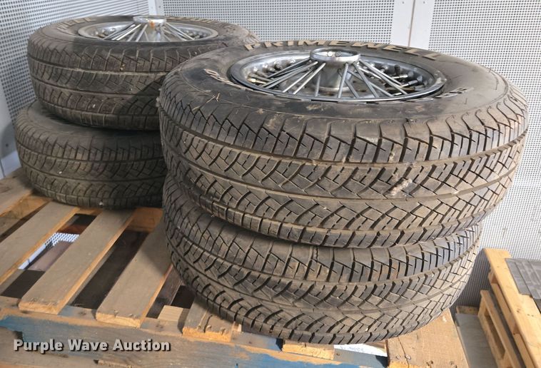 image for item EM7493 (4) 215/70R14 tires and wheels