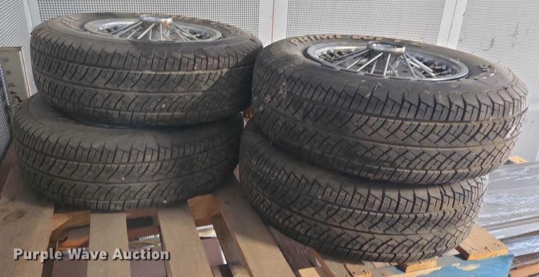 image for item EM7493 (4) 215/70R14 tires and wheels