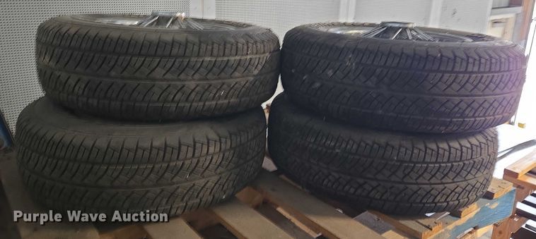 image for item EM7493 (4) 215/70R14 tires and wheels