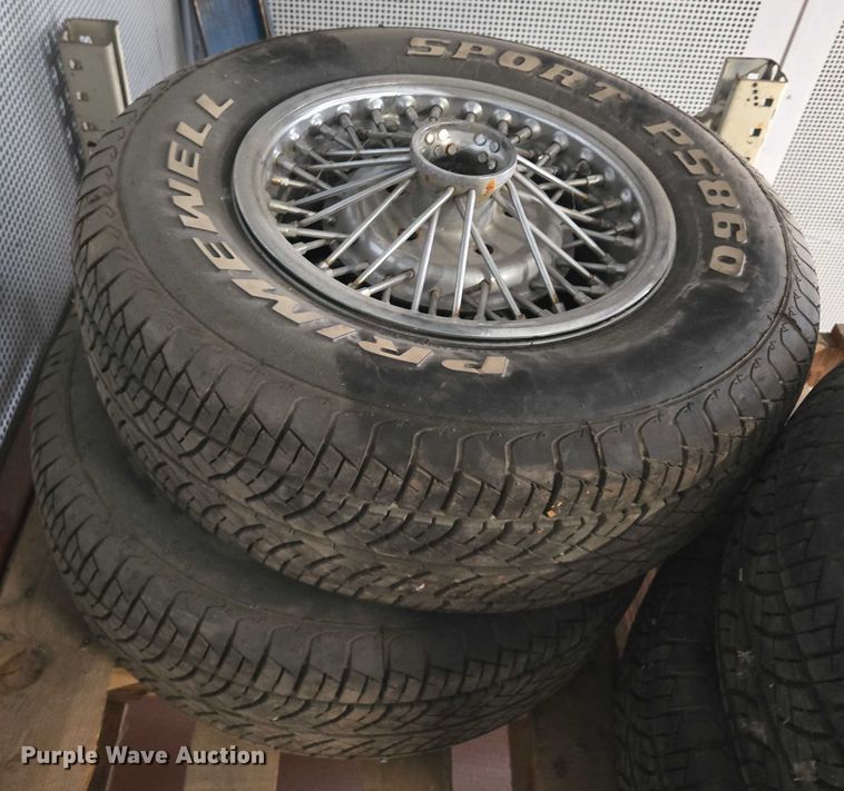 image for item EM7493 (4) 215/70R14 tires and wheels