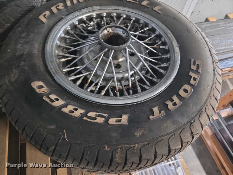 image for item EM7493 (4) 215/70R14 tires and wheels