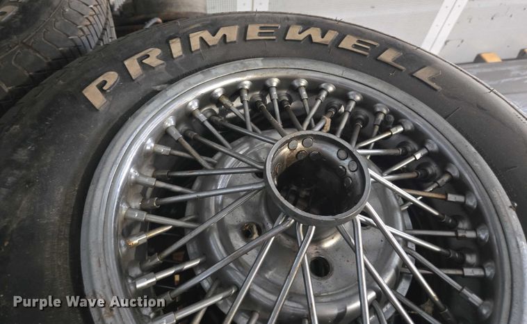 image for item EM7493 (4) 215/70R14 tires and wheels