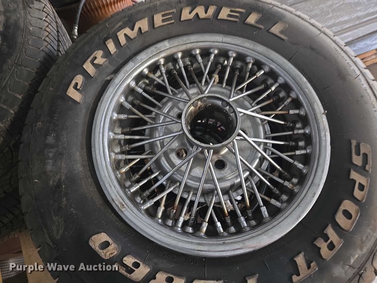 image for item EM7493 (4) 215/70R14 tires and wheels