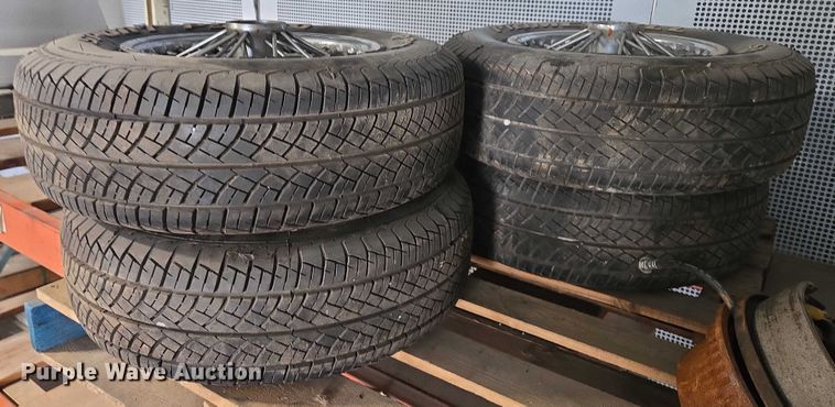 image for item EM7493 (4) 215/70R14 tires and wheels