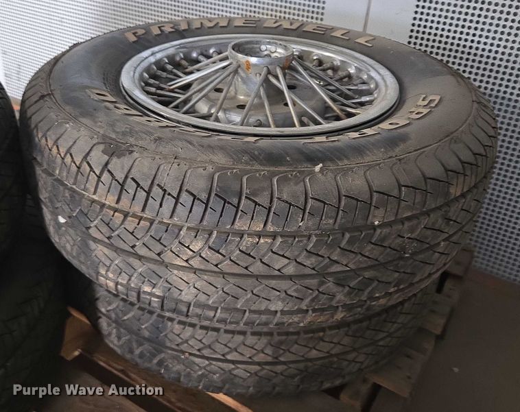 image for item EM7493 (4) 215/70R14 tires and wheels