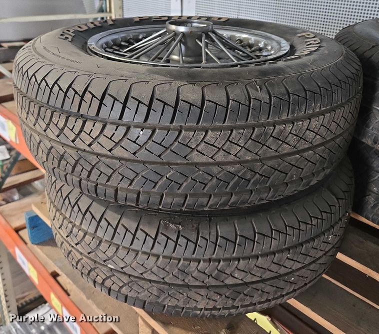 image for item EM7493 (4) 215/70R14 tires and wheels
