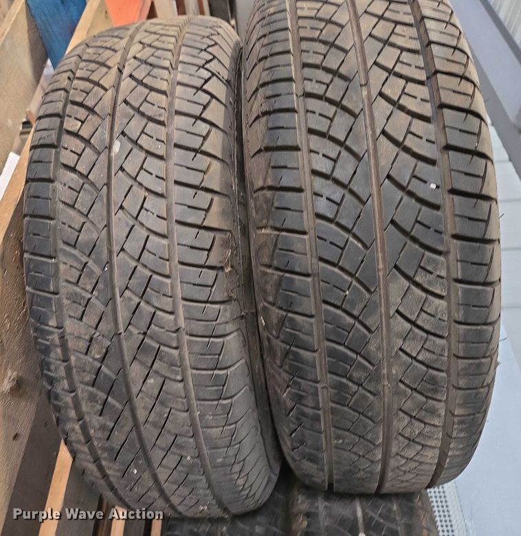 image for item EM7493 (4) 215/70R14 tires and wheels