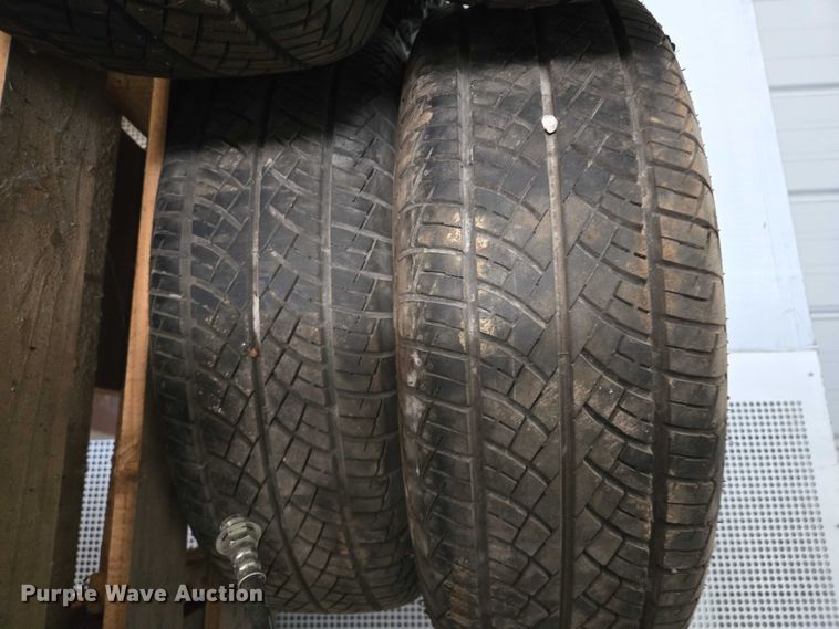 image for item EM7493 (4) 215/70R14 tires and wheels