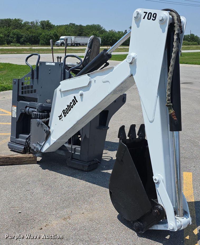 image for item EO1040 Bobcat 709 skid steer backhoe