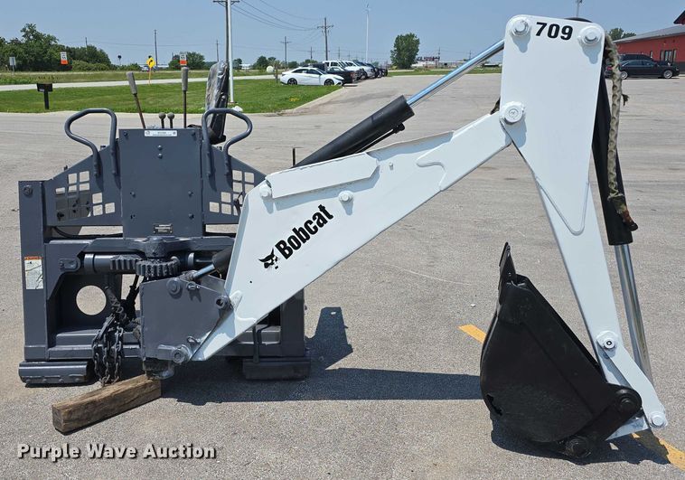 image for item EO1040 Bobcat 709 skid steer backhoe