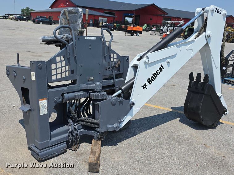 image for item EO1040 Bobcat 709 skid steer backhoe