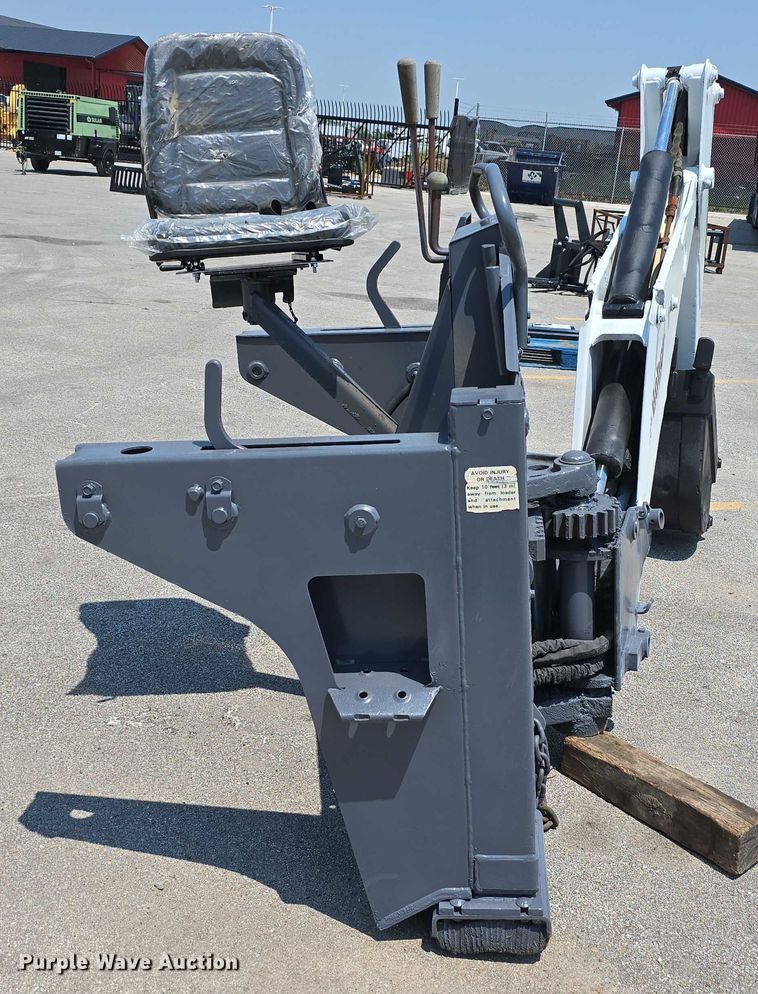 image for item EO1040 Bobcat 709 skid steer backhoe