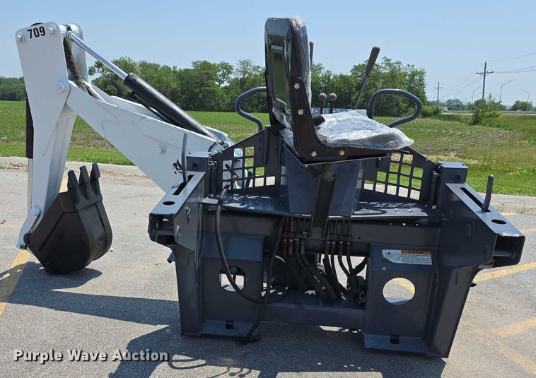 image for item EO1040 Bobcat 709 skid steer backhoe