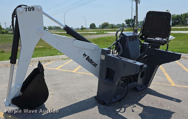 image for item EO1040 Bobcat 709 skid steer backhoe