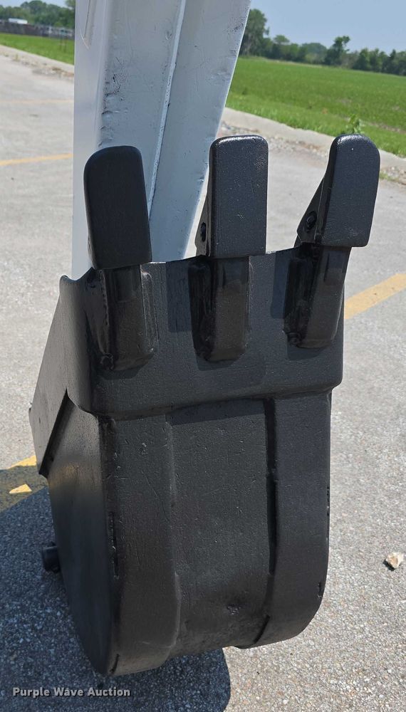 image for item EO1040 Bobcat 709 skid steer backhoe