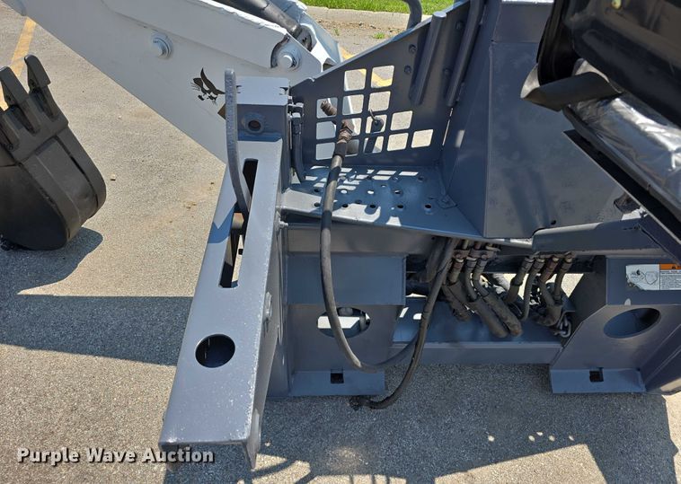 image for item EO1040 Bobcat 709 skid steer backhoe