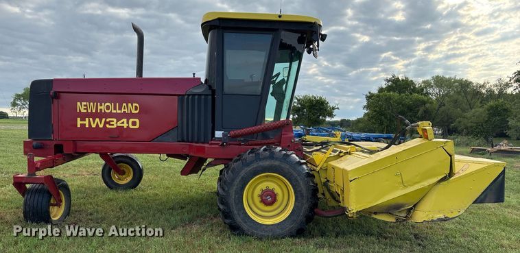 image for item DY0539 1999 New Holland HW340 swather / windrower