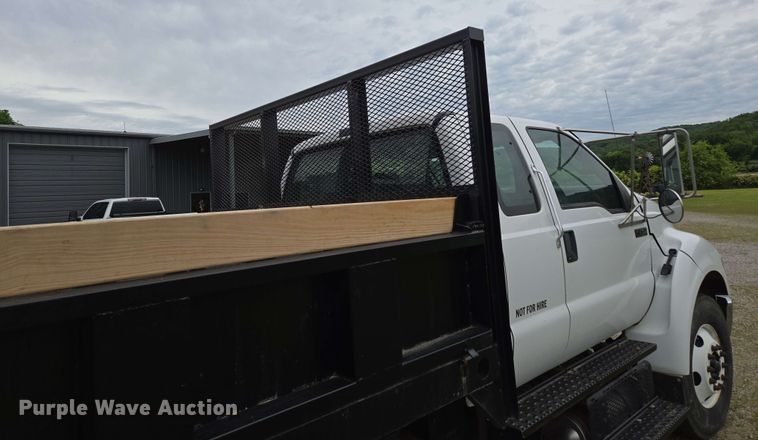 image for item DP6402 2011 Ford F750 Super Duty Ext. Cab dump flatbed truck