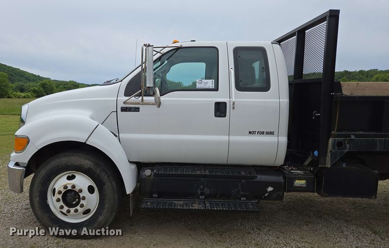 image for item DP6402 2011 Ford F750 Super Duty Ext. Cab dump flatbed truck