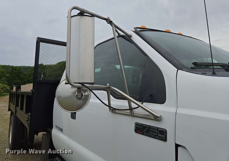 image for item DP6402 2011 Ford F750 Super Duty Ext. Cab dump flatbed truck