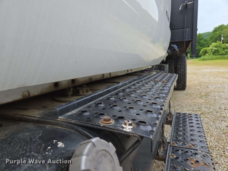 image for item DP6402 2011 Ford F750 Super Duty Ext. Cab dump flatbed truck