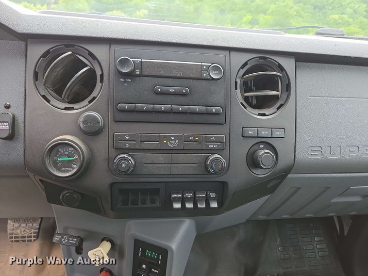 image for item DP6402 2011 Ford F750 Super Duty Ext. Cab dump flatbed truck