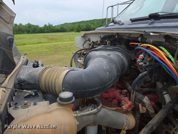 image for item DP6402 2011 Ford F750 Super Duty Ext. Cab dump flatbed truck