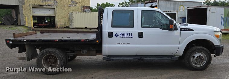 image for item ED2075 2011 Ford F350 Super Duty Crew Cab flatbed pickup truck