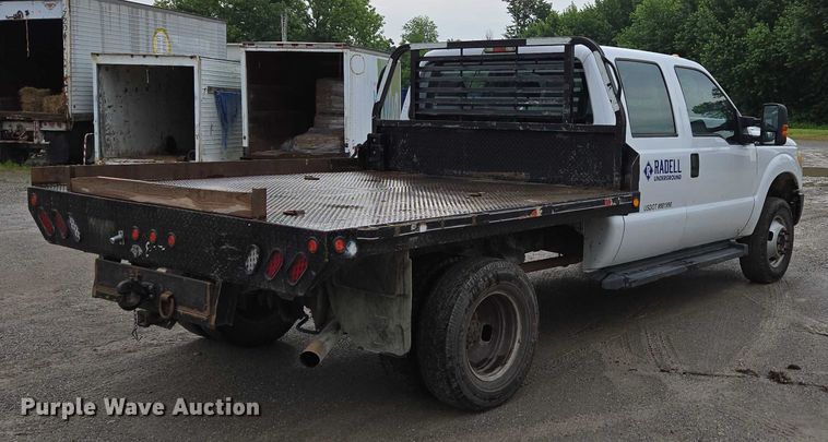 image for item ED2075 2011 Ford F350 Super Duty Crew Cab flatbed pickup truck