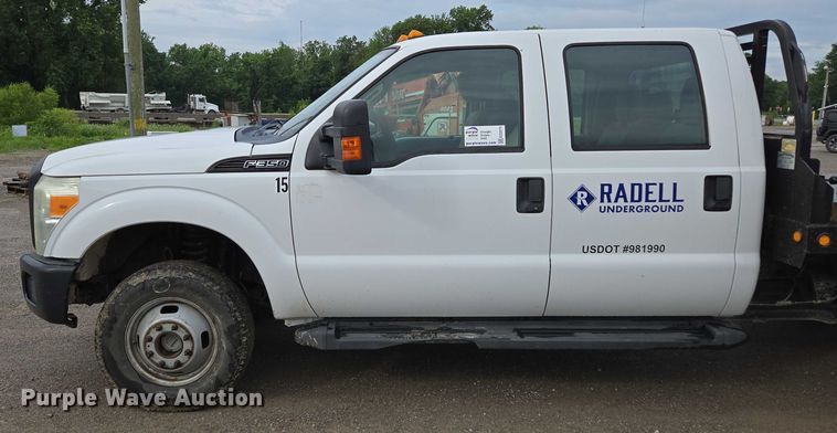 image for item ED2075 2011 Ford F350 Super Duty Crew Cab flatbed pickup truck