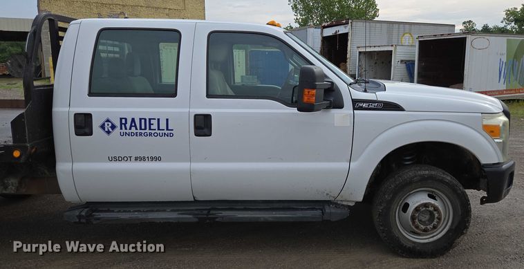 image for item ED2075 2011 Ford F350 Super Duty Crew Cab flatbed pickup truck