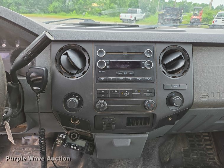 image for item ED2075 2011 Ford F350 Super Duty Crew Cab flatbed pickup truck