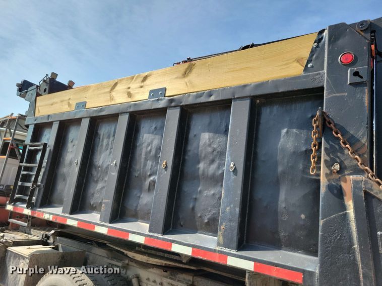 image for item DX7031 2003 Sterling LT8500 grapple crane truck